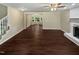 Large living area with dark flooring and staircase at 1517 Wiljohn Rd, Garner, NC 27529