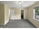Bright bedroom with grey carpeting, an ensuite bathroom, and a walk-in closet at 1517 Wiljohn Rd, Garner, NC 27529