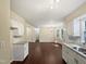 Modern kitchen featuring white cabinets and granite countertops at 1517 Wiljohn Rd, Garner, NC 27529