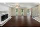 Bright living room with hardwood floors, fireplace, and lots of natural light at 1517 Wiljohn Rd, Garner, NC 27529