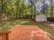 Wooden deck overlooking backyard with shed at 1517 Wiljohn Rd, Garner, NC 27529