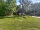 Charming house with a well-maintained lawn and red front door at 1517 Wiljohn Rd, Garner, NC 27529