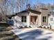 Contemporary home with two-toned siding, landscaping, and a spacious driveway at 173 Nashua Dr, Louisburg, NC 27549