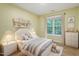 Charming bedroom with window, light walls, and wood floor at 4312 Windstorm Way, Raleigh, NC 27616