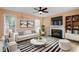 Living room with fireplace, built-in shelving, and comfortable seating at 4312 Windstorm Way, Raleigh, NC 27616