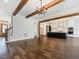 Open concept living area with hardwood floors and kitchen view at 142 Lila Dr, Pittsboro, NC 27312