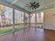Relaxing screened porch with wood flooring and wooded views at 142 Lila Dr, Pittsboro, NC 27312