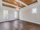 Spacious bedroom with hardwood floors and a stunning chandelier at 142 Lila Dr, Pittsboro, NC 27312