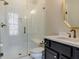 Bathroom with a large walk-in shower and modern vanity at 142 Lila Dr, Pittsboro, NC 27312
