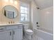 Charming bathroom with white vanity, marble floors, and a bathtub at 142 Lila Dr, Pittsboro, NC 27312