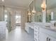 Elegant bathroom with double vanity, marble tile, and large walk-in shower at 142 Lila Dr, Pittsboro, NC 27312