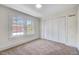 Bedroom with carpet, two windows and built-in closet at 512 S 4Th St, Smithfield, NC 27577