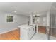 Modern kitchen with white cabinets, quartz countertops, and stainless steel appliances at 114 Glosson Cir, Carrboro, NC 27510