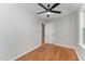 Bright bedroom featuring hardwood floors and a ceiling fan at 114 Glosson Cir, Carrboro, NC 27510