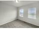 Well-lit bedroom with neutral walls and carpet flooring at 6631 Perry Creek Rd, Raleigh, NC 27616