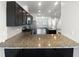 Modern kitchen with granite countertops and stainless steel appliances at 6631 Perry Creek Rd, Raleigh, NC 27616