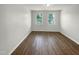 Bright bedroom with hardwood floors and windows at 6631 Perry Creek Rd, Raleigh, NC 27616