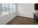 Simple dining area with hardwood flooring and large windows at 6631 Perry Creek Rd, Raleigh, NC 27616