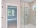 Bathroom with a large glass shower and grey tile at 10 Harvest View Way, Franklinton, NC 27525