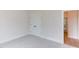 Simple bedroom with carpet, white door, and access to hallway at 10 Harvest View Way, Franklinton, NC 27525