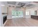 Spacious living room with fireplace, built-in shelving, and sliding glass doors leading to a porch at 10 Harvest View Way, Franklinton, NC 27525