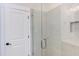 Modern shower with frameless glass enclosure and neutral tile at 10 Harvest View Way, Franklinton, NC 27525