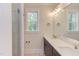 Bathroom with double vanity, quartz countertop, and large mirror at 10 Harvest View Way, Franklinton, NC 27525