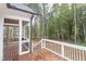 Screened porch and deck with access to backyard and wooded area at 10 Harvest View Way, Franklinton, NC 27525