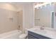 Modern bathroom with gray vanity and tile shower at 10 Harvest View Way, Franklinton, NC 27525