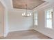 Dining room with hardwood floors, coffered ceiling, and chandelier at 10 Harvest View Way, Franklinton, NC 27525