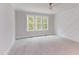 Bedroom with grey walls,carpeted floor, and geometric wall detail at 10 Harvest View Way, Franklinton, NC 27525