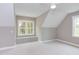 Bright bedroom with window seat and sloped ceiling at 10 Harvest View Way, Franklinton, NC 27525