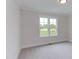 Bright bedroom with two windows and neutral carpeting at 10 Harvest View Way, Franklinton, NC 27525
