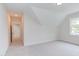 Spacious bedroom with window and access to hallway at 10 Harvest View Way, Franklinton, NC 27525