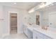 Bathroom with double vanity, walk-in closet, and gold fixtures at 10 Harvest View Way, Franklinton, NC 27525