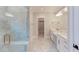 Bathroom with double vanity, frameless shower, and gold fixtures at 10 Harvest View Way, Franklinton, NC 27525