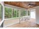 Spacious screened porch with wood flooring and ceiling fan, overlooking private backyard at 10 Harvest View Way, Franklinton, NC 27525