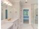 Elegant bathroom with double vanity, large mirror, and glass shower at 10 Harvest View Way, Franklinton, NC 27525