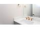 Vanity with single sink, gold faucet, and a large mirror at 10 Harvest View Way, Franklinton, NC 27525