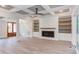 Open living room with fireplace, built-in shelving, and hardwood floors at 10 Harvest View Way, Franklinton, NC 27525