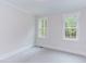 Bright bedroom with two windows and neutral carpeting at 10 Harvest View Way, Franklinton, NC 27525