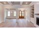 Living room with hardwood floors, high ceilings, and a view of the front door at 10 Harvest View Way, Franklinton, NC 27525
