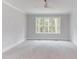 Spacious bedroom with neutral carpeting and large windows at 10 Harvest View Way, Franklinton, NC 27525