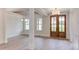Bright dining room with hardwood floors, chandelier, and access to the backyard at 10 Harvest View Way, Franklinton, NC 27525