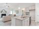 Kitchen boasts an island with granite countertops and stainless steel appliances at 22 Capeside Ct, Lillington, NC 27546