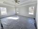 Spacious bedroom with ceiling fan and multiple windows at 40 Capeside Ct, Lillington, NC 27546