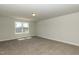 Spacious, carpeted bedroom filled with natural light from large windows at 40 Capeside Ct, Lillington, NC 27546