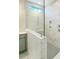 Large walk-in shower with marble tile and gray hexagon floor at 11 Claude Creek Dr, Smithfield, NC 27577