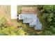 Overhead view of the house and backyard, emphasizing its roofline, landscaping, and wooded surroundings at 117 E Hamby St, Clayton, NC 27520