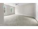 Spacious bedroom with neutral carpeting and two large windows at 2200 Wild Apple Ct, Apex, NC 27523